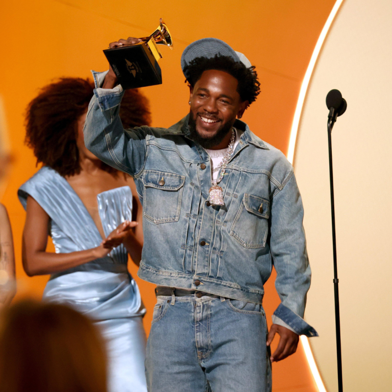 kendrick lamar holding the grammy