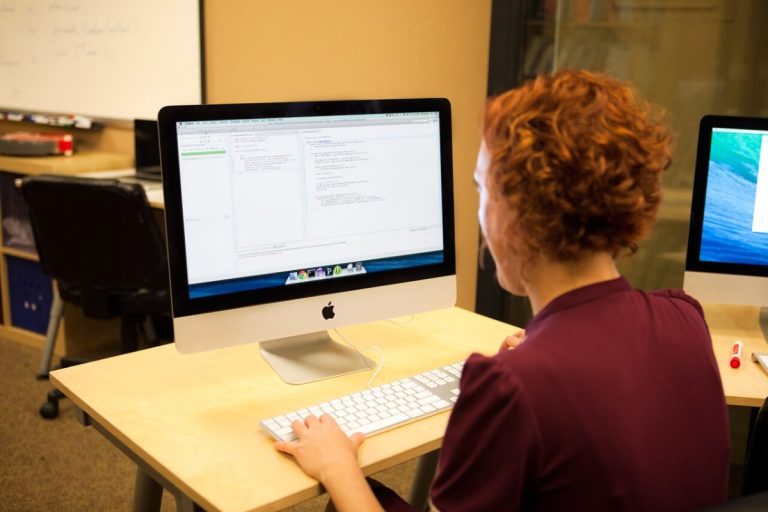 Programmer writing code with Unit Tests