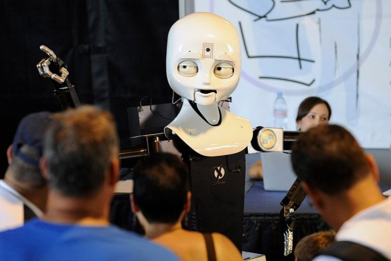 US Navy 100531-N-7676W-075 Visitors interact with the mobile, dexterous, social (MDS) robot Octavia at the Office of Nav