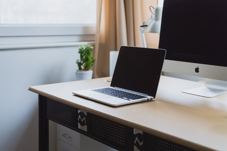 Laptop on a neat desk (Unsplash)